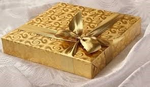Christmas gift wrapped with gold