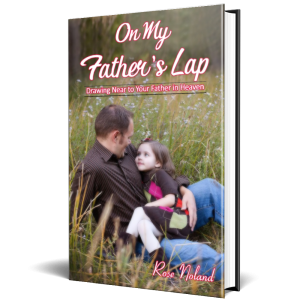 Adoring young girl sitting on her father's lap in a field