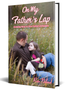 Adoring young girl sitting on her father's lap in a field