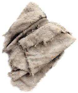 white rag with dirt and jagged edges