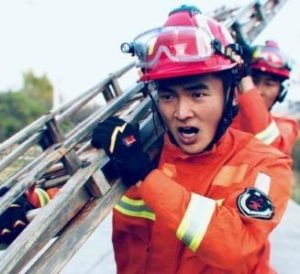 fireman with ladder on shoulder