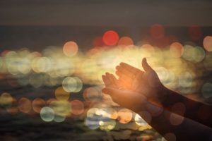 Hands outstretched upward