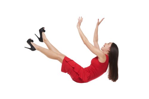 woman wearing red dress falling